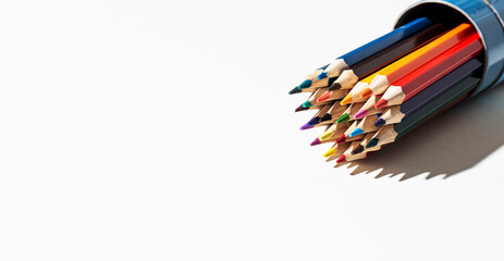 A set of colored pencils for drawing on a white background. Marketing in business sales. Banner with copy space