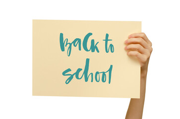 A colored poster in the girl's hand. Handwritten inscription Back to school. Isolated on white