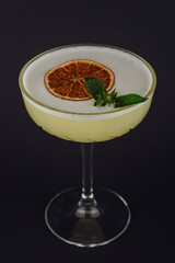 Classic margarita cocktail with mint leaves