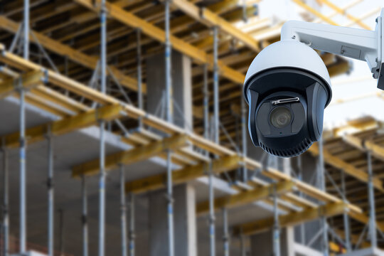 Security CCTV Camera Or Surveillance System With Construction Site On Blurry Background.