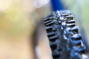 Aggressive bicycle off-road rubber tread close-up.