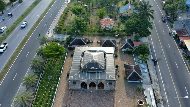 4k aerial view of Kresek mosque in Pattani,Thailand, old architecture design building from red brick clay, history landmark in islam religion at south east asia, architecture primitive for muslim pray