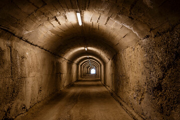 Albania, May 12, 2022 - Tunnel leading to a WWII bunker. BunkArt - obrazy, fototapety, plakaty