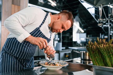 Making salad. Chef is on the kitchen preparing food