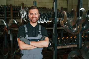 Portrait of man in uniform that is in workstation developing details of agriculture technique