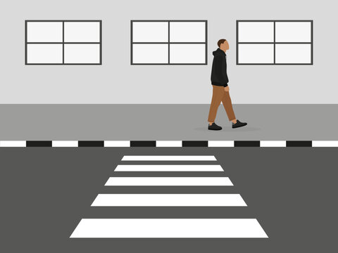 A male character walks along the sidewalk past a crosswalk