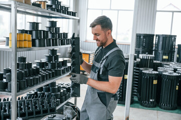Man in uniform is in workstation developing details of agriculture technique