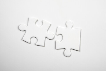 Two blank puzzle pieces on a white background. Skills and compatibility concept
