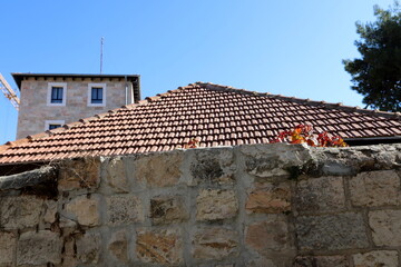 Fototapeta premium Red tiled roof on a residential building.