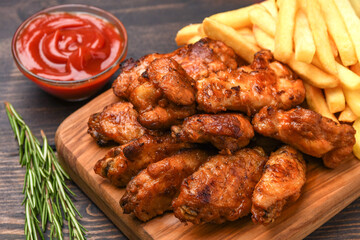 lunch fast food chicken wings with ketchup and potatoes fries