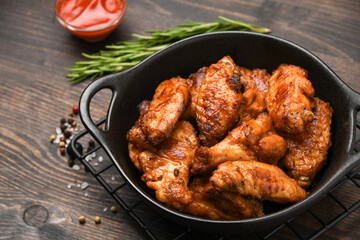 Spicy chicken wings with  ketchup