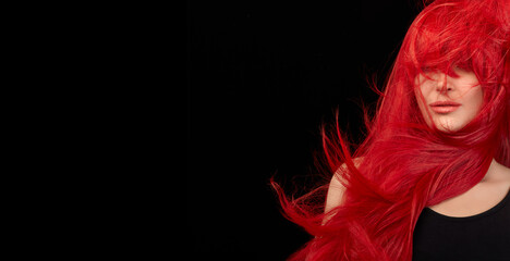 Dyed hair care and fashion concept. Fashion model girl with windswept long dyed red hair