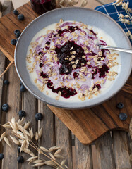 Breakfast with yogurt, blueberry compote and oats