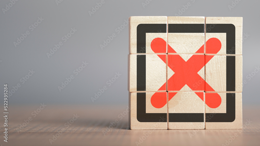 Poster red cross mark, x, wrong mark sign, rejection sign in wooden cube stack. concept of negative decisio