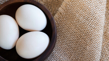 Close Up shot Duck organic eggs in the wood cup. Food for healthy life form nature farm Sell within the market.