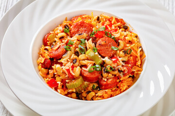 Hoppin John with rice in white bowl, top view