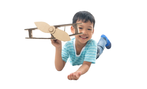 kid dreams as pilot laying and holding airplane paper isolated on white background,imagination and freedom  idea concept