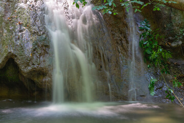 Cascade waterfall in the riverside