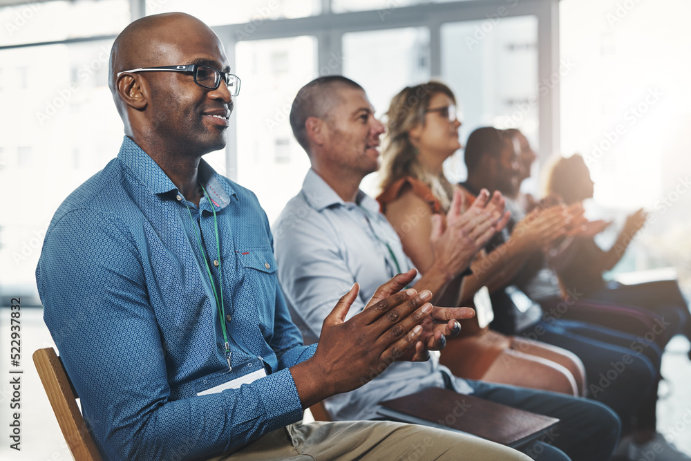 Aufkleber employees sitting and clapping together in a seminar and successful workshop. diverse workplace that
