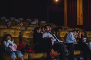 Young and adult audiences are watching horror movies in cinema.