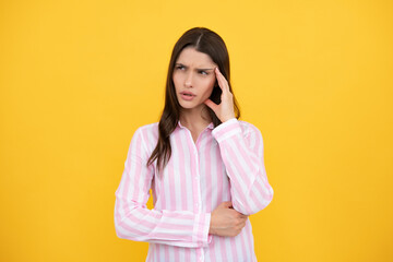 Obraz premium Portrait of young woman feeling stress or strain headache. Exhausted tired girl desperate and stressed because pain and migraine. Upset sad depressed model with hands on head.