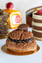 Types of cakes. Small sweet cakes on a white background. Bakery products. close up