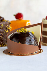 Types of cakes. Small sweet cakes on a white background. Bakery products. close up