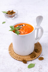 Red cream soup with sesame and basil