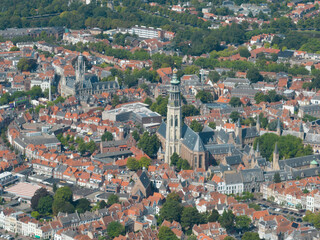 Fototapeta na wymiar The Abbey Tower 90.5 meter high church tower in the abbey complex in Middelburg. Nicknamed the Lange Jan. Amoung tallest church towers in the Netherlands. Urban city overview in Zeeland Walcheren.
