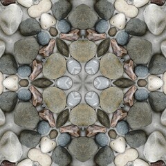 pebble patterns from many grey and white smooth stones arranged to form hexagonal floral fantasy creative designs