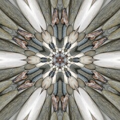 pebble patterns from many grey and white smooth stones arranged to form hexagonal floral fantasy creative designs