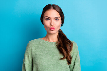 Fototapeta premium Photo of pretty coquettish lady pouted lips kiss wear pullover isolated on blue color background