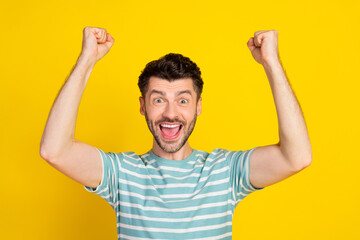 Closeup photo of young funny celebrating guy fan victory hooray win football club isolated on yellow color background