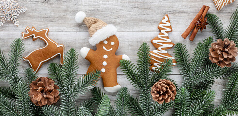 Homemade christmas gingerbread cookies on wooden table.