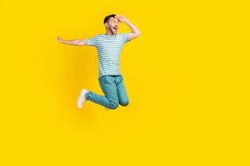 Fototapeta na wymiar Full length photo of young crazy guy have vacation finally want go travel another country isolated on yellow color background