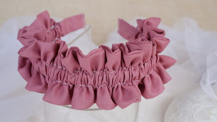 Handmade headband made out of cotton fabric texture with ruffle pattern