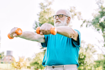 group of senior friends training at the park