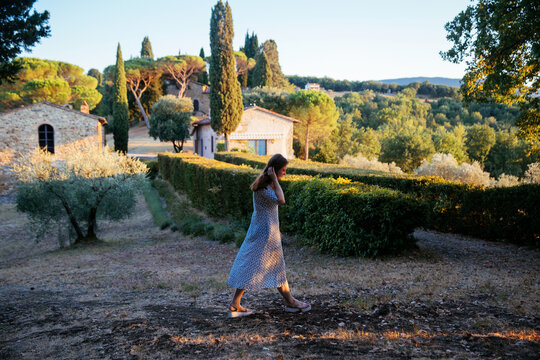 Beautiful landscape with house in Tuscany, Italy. Traditional country house, old farmhouse in Tuscany. Rural house in summer. Solo woman traveler. Solo woman travel in Tuscany, summer in Italy. 
