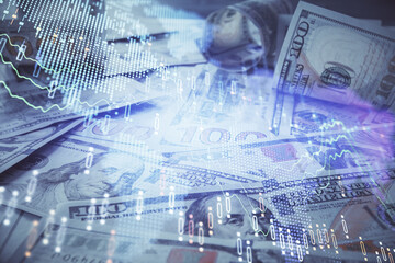 Multi exposure of forex chart drawing over us dollars bill background. Concept of financial success markets.