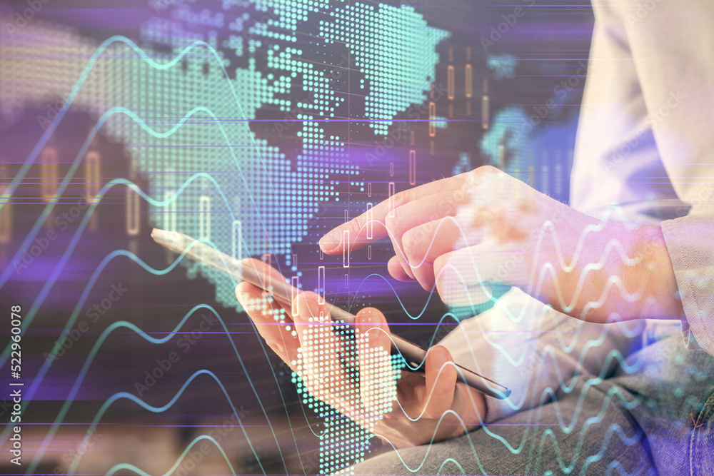 Aufkleber double exposure of man's hands holding and using a digital device and forex graph drawing. financial