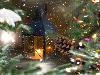 Christmas tree illumination  with cone and street lantern  under snow flakes festive city street holiday scene 