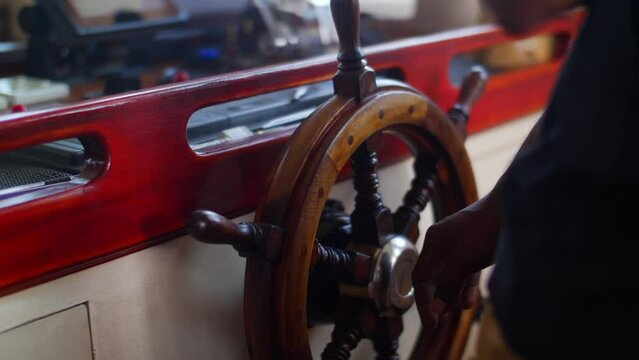 Slow Motion Shot Of Person Spinning Boat Handwheel While Traveling On Vacation - Great Barrier Reef, Australia