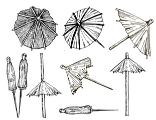 Cocktail umbrella. Cocktail umbrella sketch set. Hand drawn vector illustration isolated on white background.