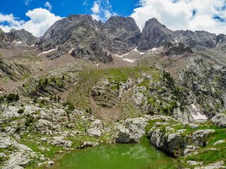 Perramo lake and Perdiguero peak at baclground in Benasque Valley, Spain