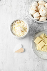 Hot white chocolate, decorated with whipped cream and cinnamon, square format