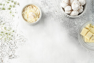Top view of Hot white chocolate with whipped cream , decorated with white meringue sweed. aesthetic beverage