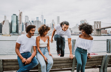 Group of friends spending time togeher in New york city - obrazy, fototapety, plakaty