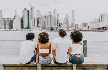 Group of friends spending time togeher in New york city - obrazy, fototapety, plakaty
