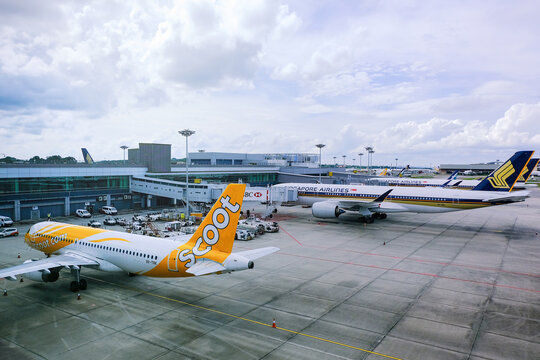 Singapore Jul 02 2020 Scoot and Singapore Airlines planes parked at Changi Airport during Covid-19 coronavirus outbreak. Restrictions on commercial flights will ease as travelling re-opens soon