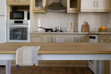 Stylish wooden kitchen with built-in appliances and small beige tile. Close up, copy space, background.